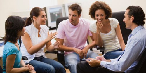 a group discussing emotional wellbeing in loughborough